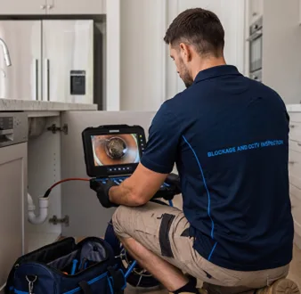 Clearing a blocked sink at a Granville property
